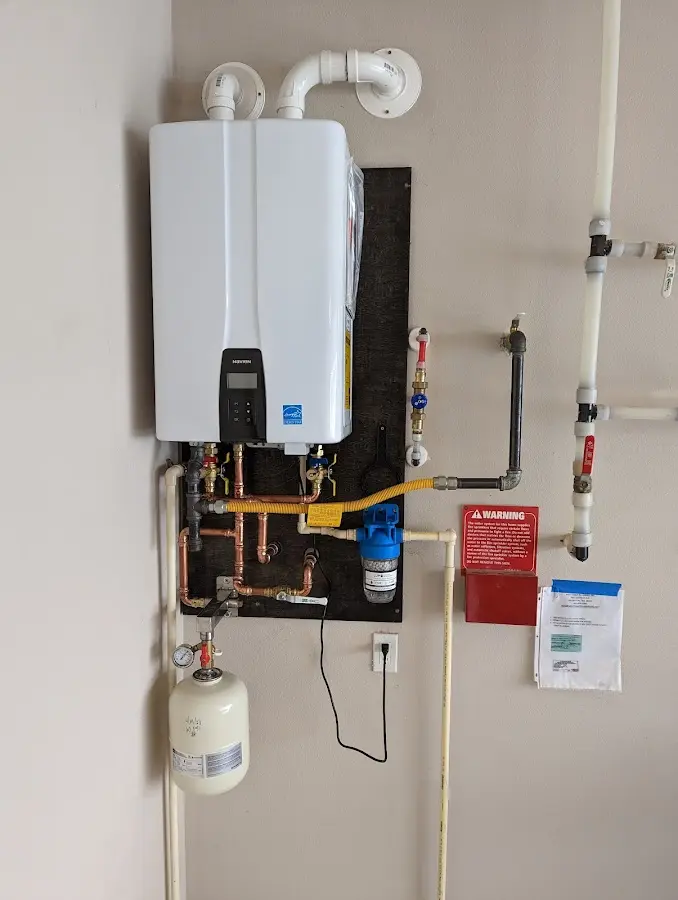 Professional plumber installing copper piping in a Cortez home